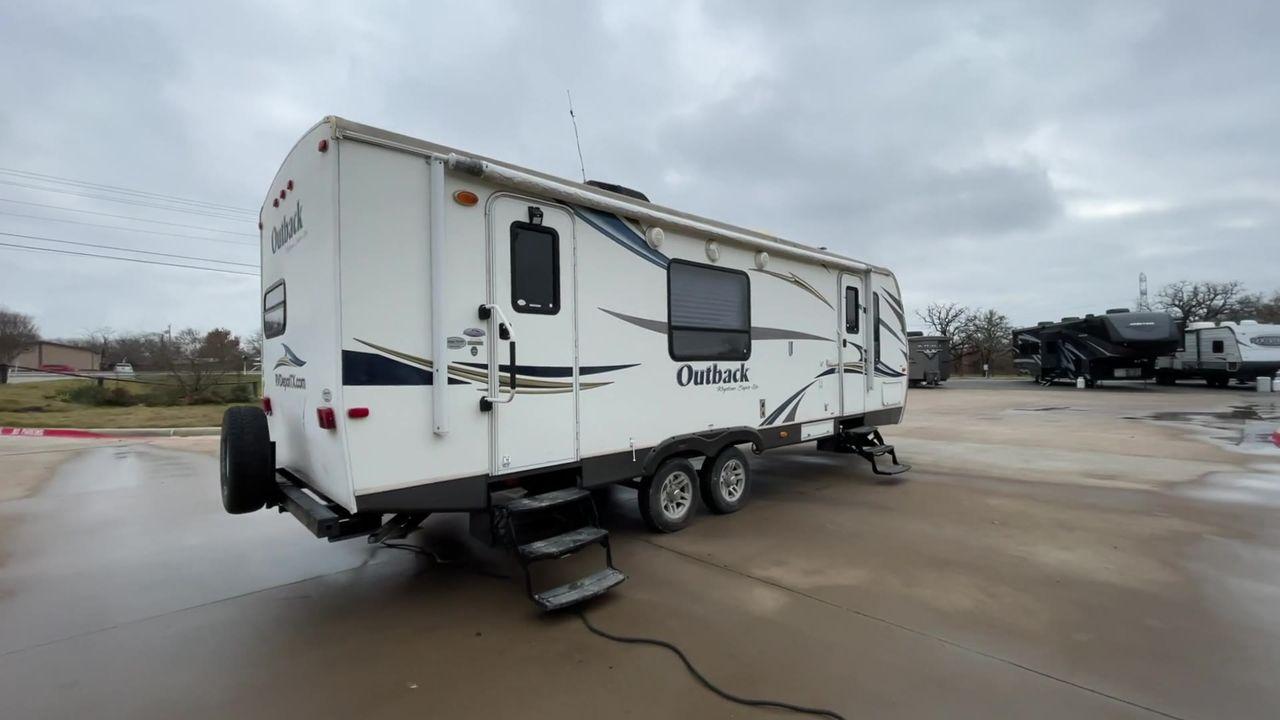 2012 WHITE KEYSTONE OUTBACK 272RK (4YDT27227CB) , Length: 30.33 ft. | Dry Weight: 5,976 lbs. | Gross Weight: 7,800 lbs. | Slides: 1 transmission, located at 4319 N Main St, Cleburne, TX, 76033, (817) 678-5133, 32.385960, -97.391212 - Photo #1