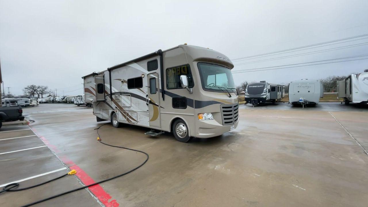 2014 TAN ACE 30.1 - (1F65F5DY8E0) , located at 4319 N Main Street, Cleburne, TX, 76033, (817) 221-0660, 32.435829, -97.384178 - Discover extra features that contribute to making this RV an ideal investment. (1) This 30-foot beauty offers ample living space, the slide-out expands the main living area. (2) It has The Ford F-Series Super Duty chassis with a Triton V10 engine offers robust power and handling (3) It is also - Photo #3