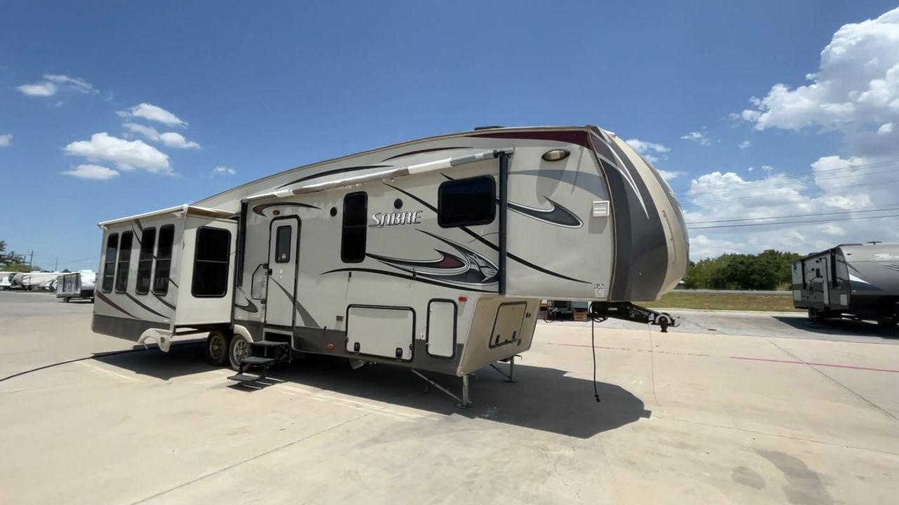 2014 TAN SABRE 34REQS-6 (4X4FSRK2XE3) , Length: 36 ft. | Dry Weight: 10,854 lbs. | Gross Weight: 13,704 lbs. | Slides: 4 transmission, located at 4319 N Main Street, Cleburne, TX, 76033, (817) 221-0660, 32.435829, -97.384178 - This RV, which measures 36 feet in length and weighs 10,854 pounds dry, is designed to provide a luxurious and sumptuous living experience when traveling. With a gross weight of 13,704 pounds and four slides, including one in the bedroom, the 2014 Sabre 3REQS-6 Fifth Wheel will allow you plenty of s - Photo #3