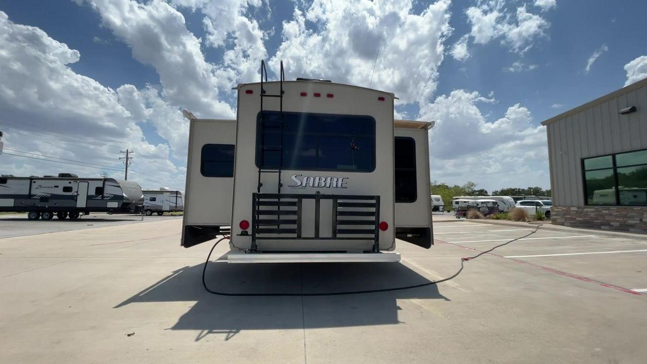 2014 TAN SABRE 34REQS-6 (4X4FSRK2XE3) , Length: 36 ft. | Dry Weight: 10,854 lbs. | Gross Weight: 13,704 lbs. | Slides: 4 transmission, located at 4319 N Main Street, Cleburne, TX, 76033, (817) 221-0660, 32.435829, -97.384178 - This RV, which measures 36 feet in length and weighs 10,854 pounds dry, is designed to provide a luxurious and sumptuous living experience when traveling. With a gross weight of 13,704 pounds and four slides, including one in the bedroom, the 2014 Sabre 3REQS-6 Fifth Wheel will allow you plenty of s - Photo #8