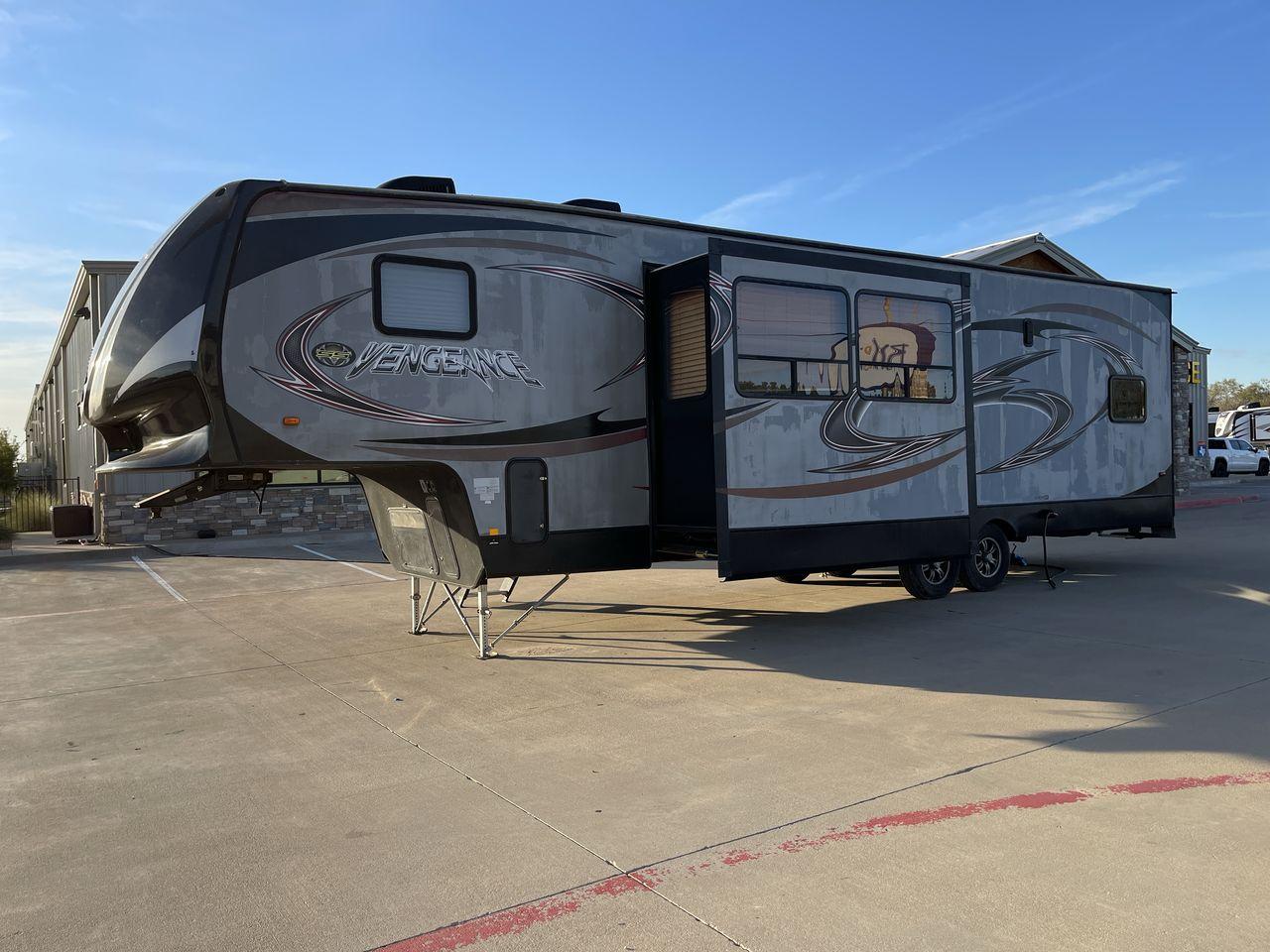 2014 WHITE FOREST RIVER VENGEANCE 312A (4X4FVGG22EY) , Length: 37.92 ft. | Dry Weight: 10,068 lbs. | Gross Weight: 14,508 lbs. | Slides: 1 transmission, located at 4319 N Main St, Cleburne, TX, 76033, (817) 678-5133, 32.385960, -97.391212 - This 2014 Vengeance Toy Hauler has a dry weight of 10,068 lbs and a GVWR of 14,508 lbs with a hitch weight of 2,508 lbs. This unit also has automatic heating and cooling for optimal temperature control. The exterior of this toy hauler is a simple cream base with black and red accents. This model als - Photo #22