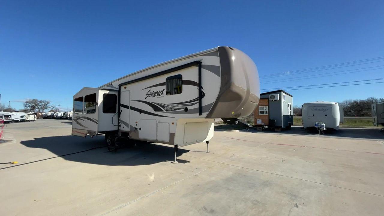 2015 TAN FOREST RIVER CEDAR CREEK 29RE (4X4FCRE21FS) , Length: 33.92 ft. | Dry Weight: 9,790 lbs. | Gross Weight: 13,615 lbs. | Slides: 3 transmission, located at 4319 N Main St, Cleburne, TX, 76033, (817) 678-5133, 32.385960, -97.391212 - Photo #3