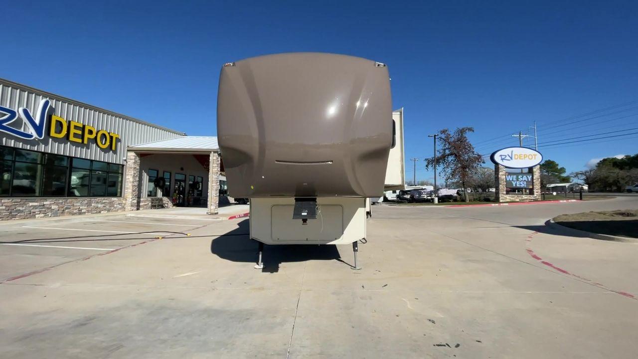 2015 TAN FOREST RIVER CEDAR CREEK 29RE (4X4FCRE21FS) , Length: 33.92 ft. | Dry Weight: 9,790 lbs. | Gross Weight: 13,615 lbs. | Slides: 3 transmission, located at 4319 N Main Street, Cleburne, TX, 76033, (817) 221-0660, 32.435829, -97.384178 - The 2015 Forest River Cedar Creek Silverback 29RE is a 33 ft trailer with three slides that offers a spacious and inviting interior, perfect for both short getaways and extended adventures. When you walk inside, you'll be met by beautiful furniture and well-thought-out design elements that make camp - Photo #4