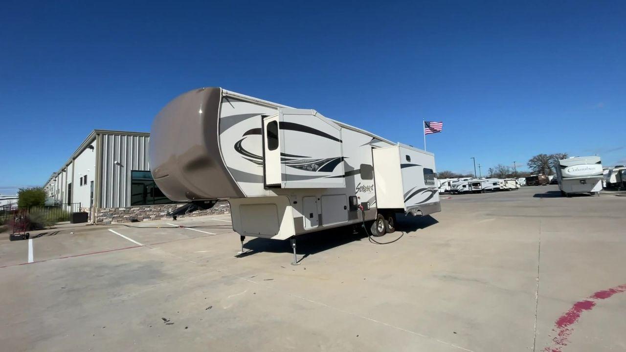 2015 TAN FOREST RIVER CEDAR CREEK 29RE (4X4FCRE21FS) , Length: 33.92 ft. | Dry Weight: 9,790 lbs. | Gross Weight: 13,615 lbs. | Slides: 3 transmission, located at 4319 N Main St, Cleburne, TX, 76033, (817) 678-5133, 32.385960, -97.391212 - The 2015 Forest River Cedar Creek Silverback 29RE is a 33 ft trailer with three slides that offers a spacious and inviting interior, perfect for both short getaways and extended adventures. When you walk inside, you'll be met by beautiful furniture and well-thought-out design elements that make camp - Photo #5