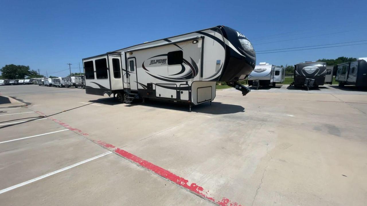 2015 WHITE KEYSTONE ALPINE 3535RE (4YDF35320FE) , Length: 39.08 ft. | Dry Weight: 12,416 lbs. | Gross Weight: 15,500 lbs. | Slides: 4 transmission, located at 4319 N Main Street, Cleburne, TX, 76033, (817) 221-0660, 32.435829, -97.384178 - Improve your RV experience with the 2015 Keystone Alpine 3535RE, a high-end fifth wheel that embodies ease and style. This model, which is an impressive 39.08 feet long, was carefully made for discerning travelers who want a perfect mix of style and usefulness. Because it is made of an aluminum body - Photo #3