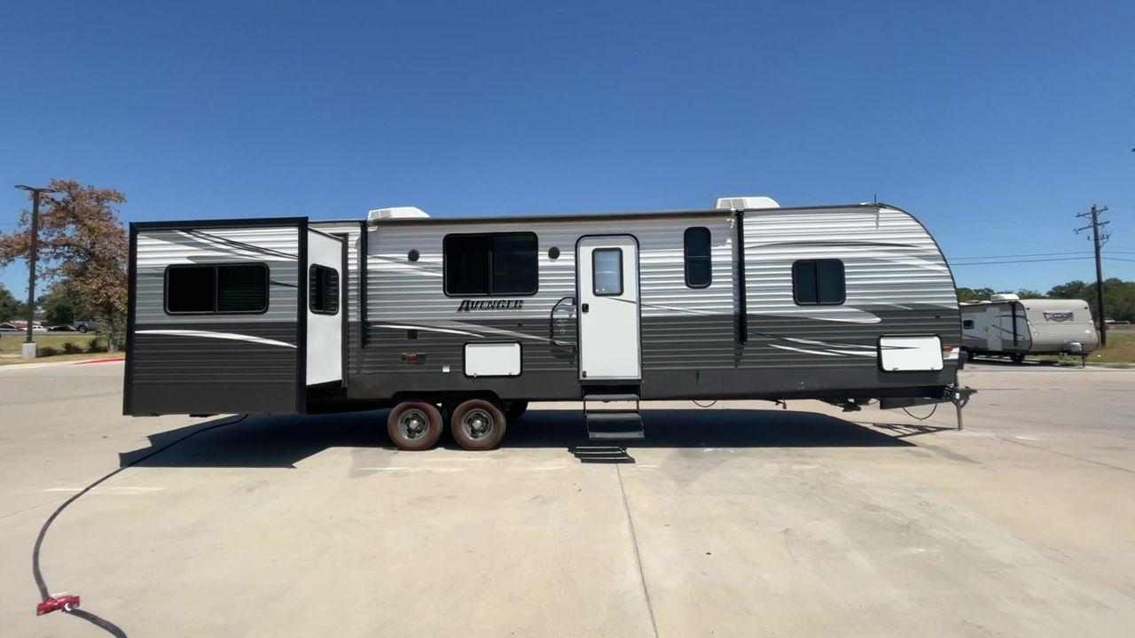 2019 TAN FOREST RIVER AVENGER 32DEN (5ZT2AVXB6KB) , Length: 37.92 ft. | Dry Weight: 7,989 lbs. | Slides: 2 transmission, located at 4319 N Main St, Cleburne, TX, 76033, (817) 678-5133, 32.385960, -97.391212 - Measuring an impressive 36 feet, this model unfolds to reveal two strategically placed slide-outs, creating a spacious haven for relaxation. The master bedroom welcomes you with a queen-size bed and ample storage, ensuring a peaceful retreat after a day of outdoor exploration. The living area is a h - Photo #2