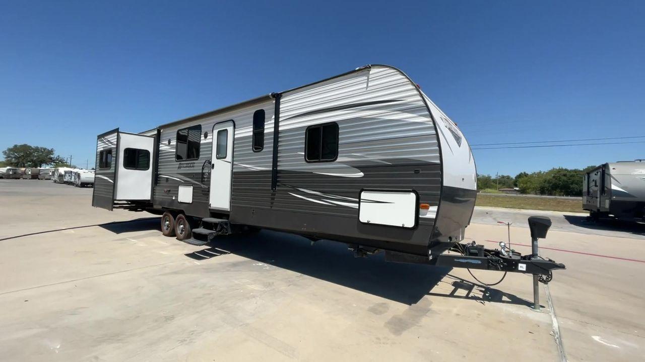 2019 TAN FOREST RIVER AVENGER 32DEN (5ZT2AVXB6KB) , Length: 37.92 ft. | Dry Weight: 7,989 lbs. | Slides: 2 transmission, located at 4319 N Main Street, Cleburne, TX, 76033, (817) 221-0660, 32.435829, -97.384178 - Measuring an impressive 36 feet, this model unfolds to reveal two strategically placed slide-outs, creating a spacious haven for relaxation. The master bedroom welcomes you with a queen-size bed and ample storage, ensuring a peaceful retreat after a day of outdoor exploration. The living area is a h - Photo #3