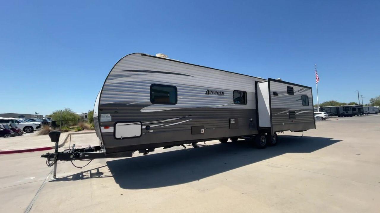 2019 TAN FOREST RIVER AVENGER 32DEN (5ZT2AVXB6KB) , Length: 37.92 ft. | Dry Weight: 7,989 lbs. | Slides: 2 transmission, located at 4319 N Main Street, Cleburne, TX, 76033, (817) 221-0660, 32.435829, -97.384178 - Measuring an impressive 36 feet, this model unfolds to reveal two strategically placed slide-outs, creating a spacious haven for relaxation. The master bedroom welcomes you with a queen-size bed and ample storage, ensuring a peaceful retreat after a day of outdoor exploration. The living area is a h - Photo #5