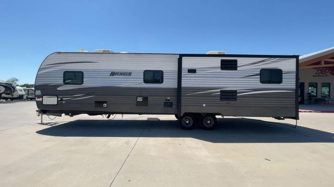 2019 TAN FOREST RIVER AVENGER 32DEN (5ZT2AVXB6KB) , Length: 37.92 ft. | Dry Weight: 7,989 lbs. | Slides: 2 transmission, located at 4319 N Main St, Cleburne, TX, 76033, (817) 678-5133, 32.385960, -97.391212 - Measuring an impressive 36 feet, this model unfolds to reveal two strategically placed slide-outs, creating a spacious haven for relaxation. The master bedroom welcomes you with a queen-size bed and ample storage, ensuring a peaceful retreat after a day of outdoor exploration. The living area is a h - Photo #6