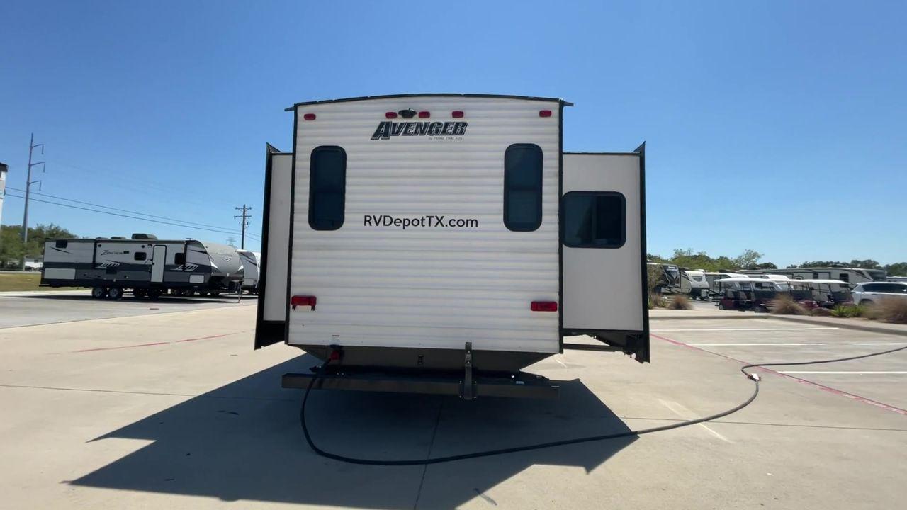 2019 TAN FOREST RIVER AVENGER 32DEN (5ZT2AVXB6KB) , Length: 37.92 ft. | Dry Weight: 7,989 lbs. | Slides: 2 transmission, located at 4319 N Main St, Cleburne, TX, 76033, (817) 678-5133, 32.385960, -97.391212 - Measuring an impressive 36 feet, this model unfolds to reveal two strategically placed slide-outs, creating a spacious haven for relaxation. The master bedroom welcomes you with a queen-size bed and ample storage, ensuring a peaceful retreat after a day of outdoor exploration. The living area is a h - Photo #8
