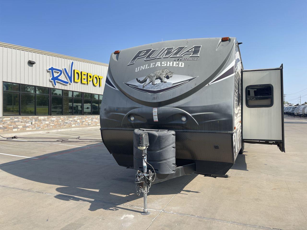 2015 PALOMINO PUMA UNLEASHED 30THS (4X4TPTF22FP) , Length: 35.33 ft. | Dry Weight: 7,345 lbs. | Gross Weight: 10,879 lbs. | Slides: 1 transmission, located at 4319 N Main St, Cleburne, TX, 76033, (817) 678-5133, 32.385960, -97.391212 - The 2015 Palomino Puma Unleashed 30THS is a dual-axle steel wheel setup measuring 35.33 ft. in length. It has a dry weight of 7,345 lbs. and a GVWR of 10,879 lbs. Its exterior is a base color of tan with cool black graphics. It includes one power slide as well as one 16-foot power awning. This toy h - Photo #0