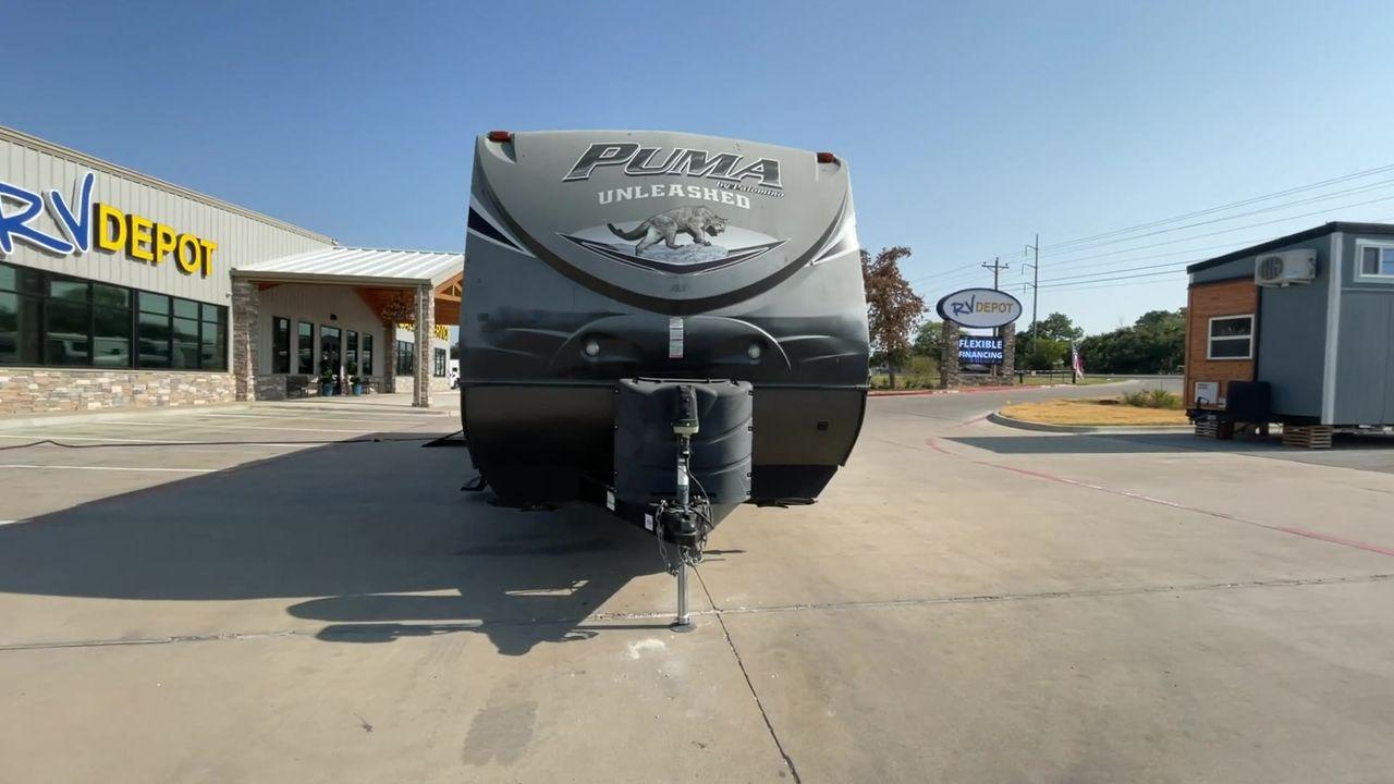 2015 PALOMINO PUMA UNLEASHED 30THS (4X4TPTF22FP) , Length: 35.33 ft. | Dry Weight: 7,345 lbs. | Gross Weight: 10,879 lbs. | Slides: 1 transmission, located at 4319 N Main St, Cleburne, TX, 76033, (817) 678-5133, 32.385960, -97.391212 - The 2015 Palomino Puma Unleashed 30THS is a dual-axle steel wheel setup measuring 35.33 ft. in length. It has a dry weight of 7,345 lbs. and a GVWR of 10,879 lbs. Its exterior is a base color of tan with cool black graphics. It includes one power slide as well as one 16-foot power awning. This toy h - Photo #6