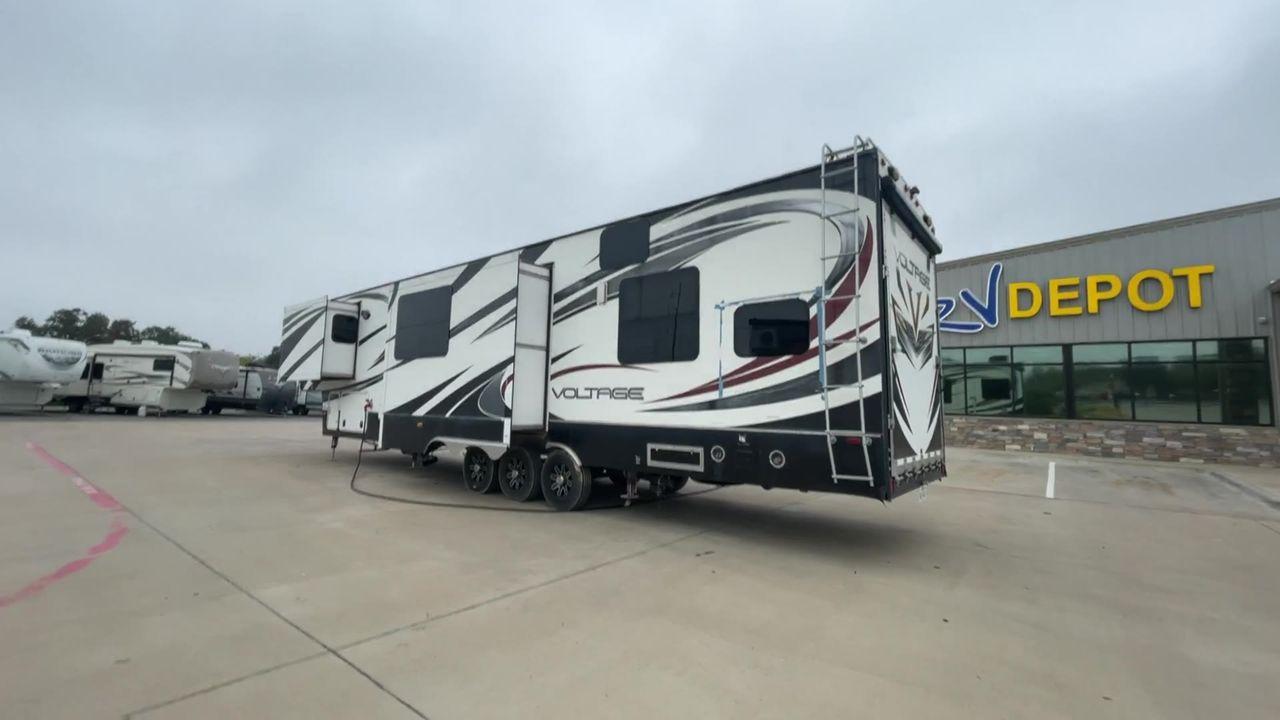 2014 DUTCHMEN VOLTAGE 3970 (47CFVTV33EC) , Length: 44 ft. Slides: 3 transmission, located at 4319 N Main St, Cleburne, TX, 76033, (817) 678-5133, 32.385960, -97.391212 - This 2014 Dutchmen Voltage 3970 has you covered when it comes to spaciousness, comfort, and luxury! This toy hauler is a triple-axle aluminum wheel set-up measuring 44 ft. in length and 13.33 ft. in height. It comes with 3 slides to provide more interior flooring. The cargo area has a whole 11 - Photo #9
