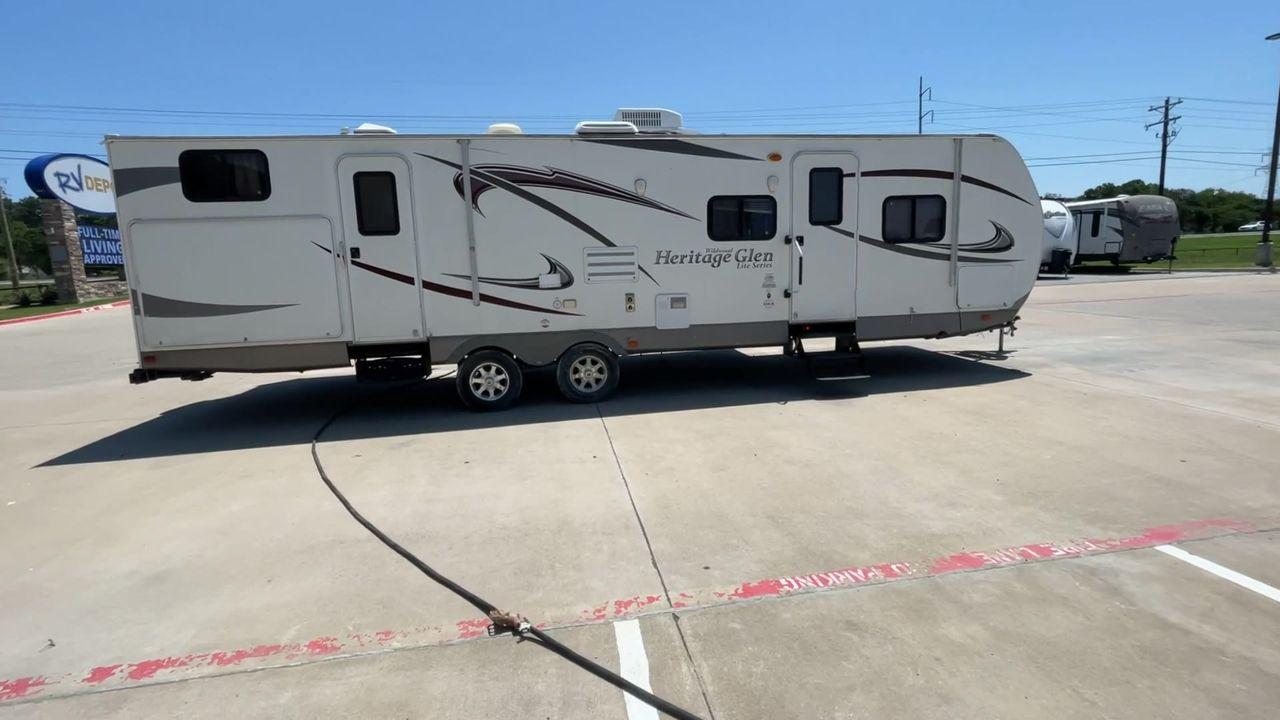 2013 FOREST RIVER HERITAGE GLEN 312QBU (4X4TWBG20DU) , Length: 35.83 ft | Dry Weight: 6,840 lbs. | Slides: 2 transmission, located at 4319 N Main Street, Cleburne, TX, 76033, (817) 221-0660, 32.435829, -97.384178 - The 2013 Forest River Heritage Glen 312QBUD is a travel trailer that changes the way you camp by combining comfort, style, and usefulness in a perfect way. This 35.83-foot marvel is made to make every trip an exciting adventure to remember. When it comes to weight, the Heritage Glen 312QBUD is made - Photo #2