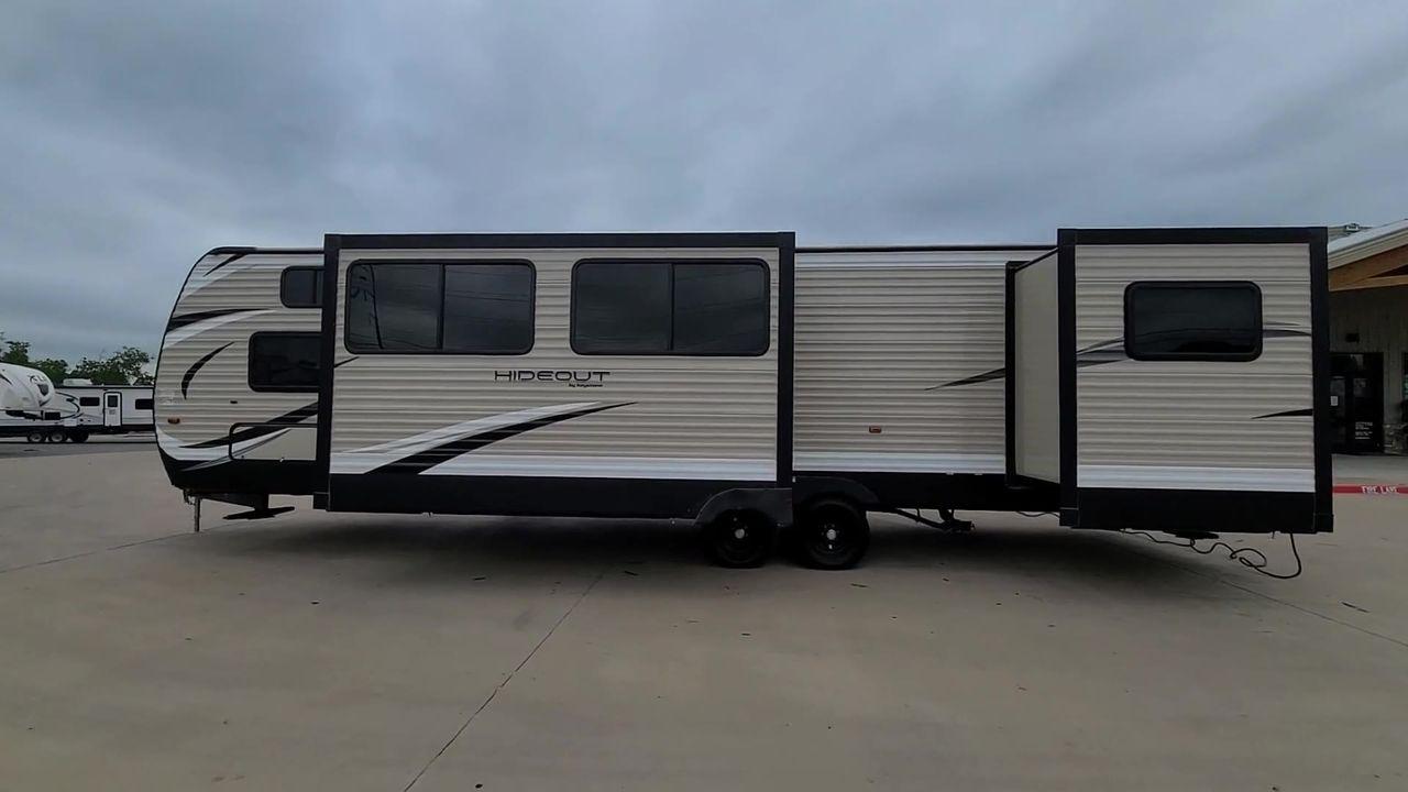 2019 KEYSTONE HIDEOUT 32BHTS (4YDT32F20K3) , Length: 37.67 ft. | Dry Weight: 8,634 lbs. | Gross Weight: 11,200 lbs. | Slides: 3 transmission, located at 4319 N Main Street, Cleburne, TX, 76033, (817) 221-0660, 32.435829, -97.384178 - The 2019 Keystone Hideout 32BHTS is a spacious and family-friendly travel trailer, measuring 37 feet 7 inches in length, 8 feet in width, and 11 feet 4 inches in height, with a dry weight of 8,600 lbs and a GVWR of 11,200 lbs. Constructed with a cambered chassis and a full walk-on roof on a powder-c - Photo #2