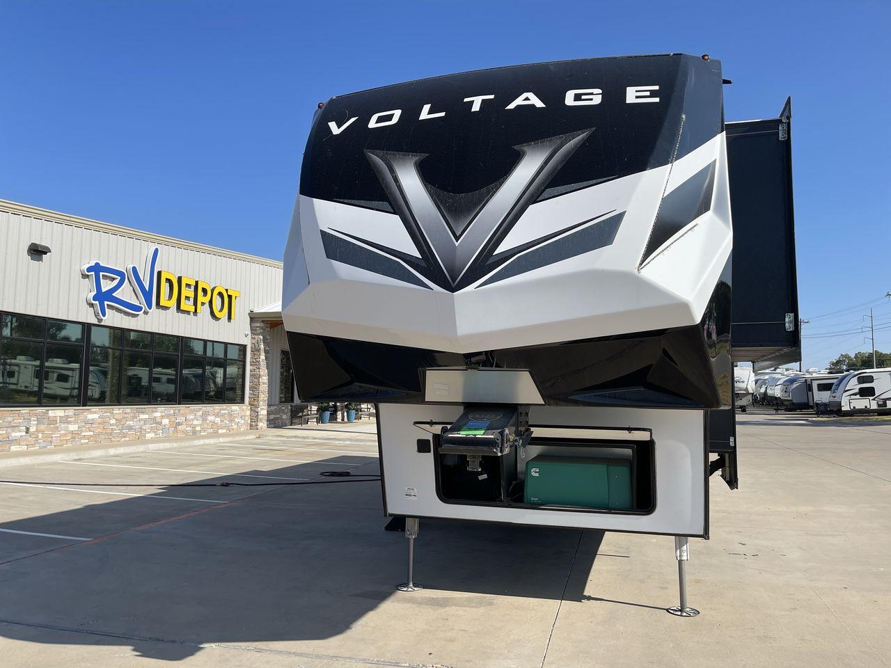 2021 KEYSTONE VOLTAGE 3615 (4YDF36128MZ) , Length: 38.92 ft. | Dry Weight: 14,020 lbs. | Slides: 3 transmission, located at 4319 N Main St, Cleburne, TX, 76033, (817) 678-5133, 32.385960, -97.391212 - The 2021 Keystone Voltage 3615, an exceptional fifth-wheel toy hauler that seamlessly combines luxury with versatility. Measuring 39 feet in length, this model features three slide-outs, providing an expansive and well-designed interior. The 3615 boasts a master bedroom with a king-size bed and ampl - Photo #0