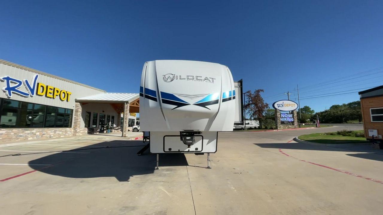 2021 FOREST RIVER WILDCAT 336RLS (4X4FWCK21MG) , Length: 34.67 ft. | Dry Weight: 10,459 lbs. | Gross Weight: 13,940 lbs. | Slides: 3 transmission, located at 4319 N Main St, Cleburne, TX, 76033, (817) 678-5133, 32.385960, -97.391212 - Reasons to buy this RV include the following: (1) It is equipped with the 34'8" layout and multiple slide-outs offer ample room to spread out and create lasting memories. (2) It has heated floors, a fireplace, and a washer/dryer ensure every comfort (3) Stay connected with the Wildcat Smart Syste - Photo #4
