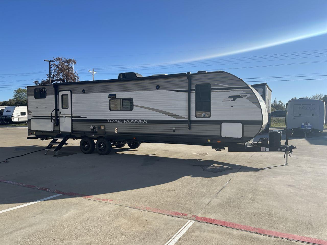 2023 HEARTLAND TRAIL RUNNER 31DB (5SFEB372XPE) , Length: 36.92 ft | Dry Weight: 7,040 lbs | GVWR: 9,642 lbs | Slides: 1 transmission, located at 4319 N Main St, Cleburne, TX, 76033, (817) 678-5133, 32.385960, -97.391212 - If you're in the market for a reliable and spacious travel trailer bunk house, look no further than this 2023 Heartland Trail Runner 31DB available at RV Depot in Cleburne, TX. With its affordable price of $37,995, this vehicle offers exceptional value for families or groups looking to embark on unf - Photo #25