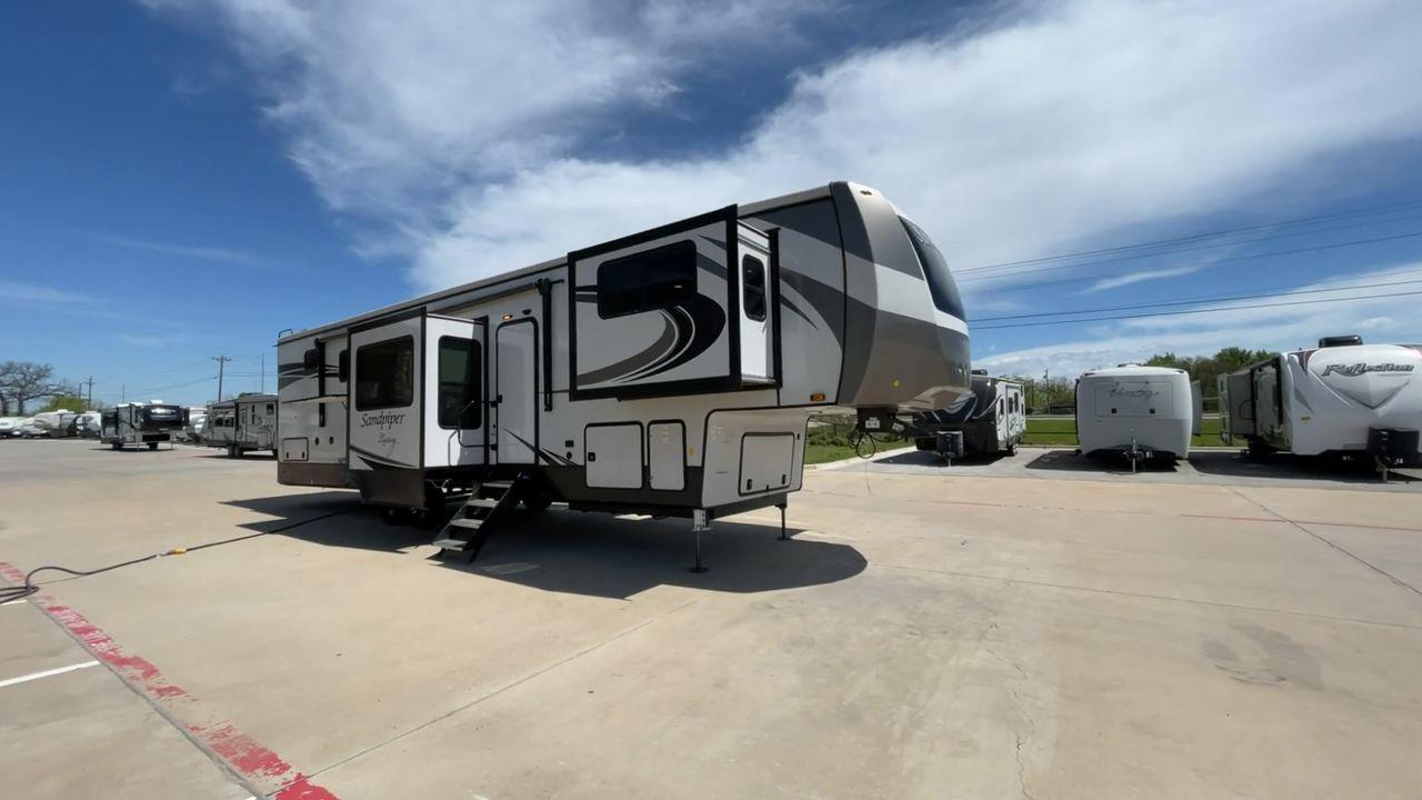 2022 FOREST RIVER SANDPIPER 391FLRB (4X4FSAR26NJ) , Length: 43.5 ft. | Dry Weight: 13,009 lbs | Gross Weight: 16,009 lbs | Slides: 5 transmission, located at 4319 N Main Street, Cleburne, TX, 76033, (817) 221-0660, 32.435829, -97.384178 - The 2022 Forest River Sandpiper 391FLRB is elegance meets adventure in the great outdoors. This fifth wheel, standing at 43.5 feet tall and featuring an aluminum body and fiberglass sides, is a symbol of durability and style on the road. It weighs 13,009 lbs. dry and can carry up to 16,009 lbs gross - Photo #3
