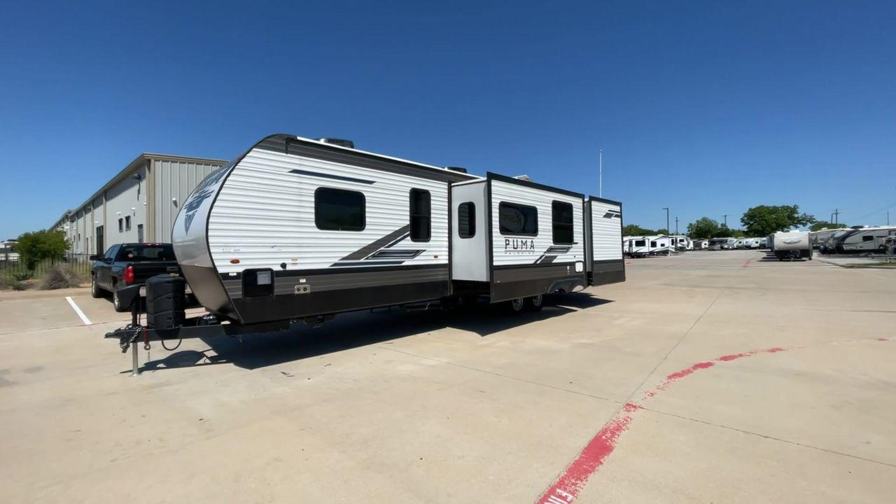 2023 FOREST RIVER PUMA 32BH2B (4X4TPUH21PP) , Length: 38.5 ft. | Dry Weight: 9,023 lbs. | Gross Weight: 11,230 lbs | Slides: 3 transmission, located at 4319 N Main St, Cleburne, TX, 76033, (817) 678-5133, 32.385960, -97.391212 - With its ample space and adaptability, the 2023 Palomino Puma 32BH2B travel trailer is perfect for hosting extended families and gatherings. This model provides generous living space while maintaining excellent maneuverability on the road. It measures 38.5 feet in length and has a dry weight of 9,02 - Photo #5